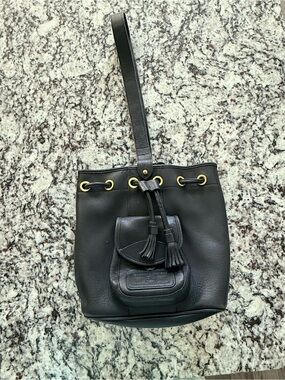 Vintage Dooney and Bourke Black Leather Drawstring Sling Bag with Tassels